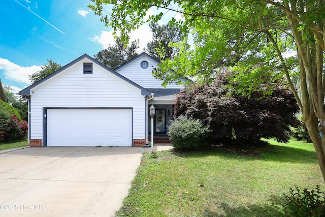 view of front of property with an attached garage, driveway, and a front lawn