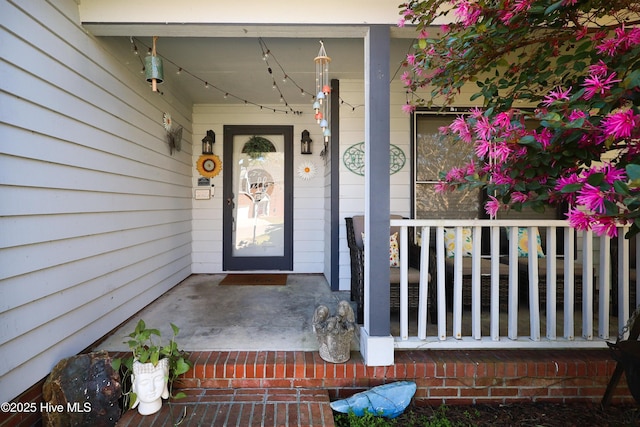 entrance to property featuring a porch