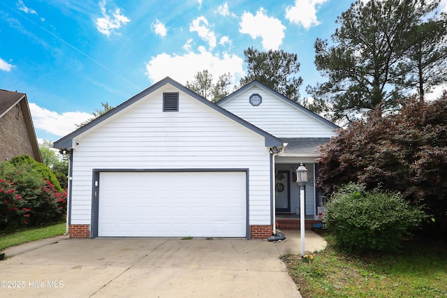 ranch-style home with an attached garage and driveway