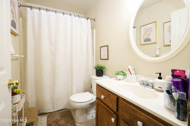 bathroom with curtained shower, vanity, tile patterned flooring, and toilet