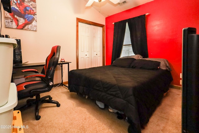 bedroom with a closet, carpet floors, visible vents, and a ceiling fan