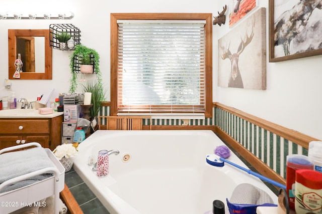 full bath with a bath and vanity