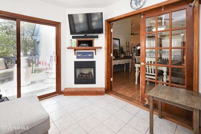 living area featuring tile patterned flooring and a fireplace