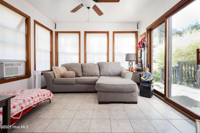 living room featuring cooling unit, plenty of natural light, light tile patterned floors, and ceiling fan