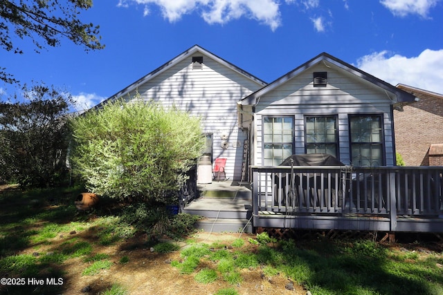 back of property with a deck