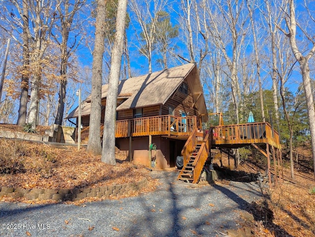 exterior space featuring stairway and a deck