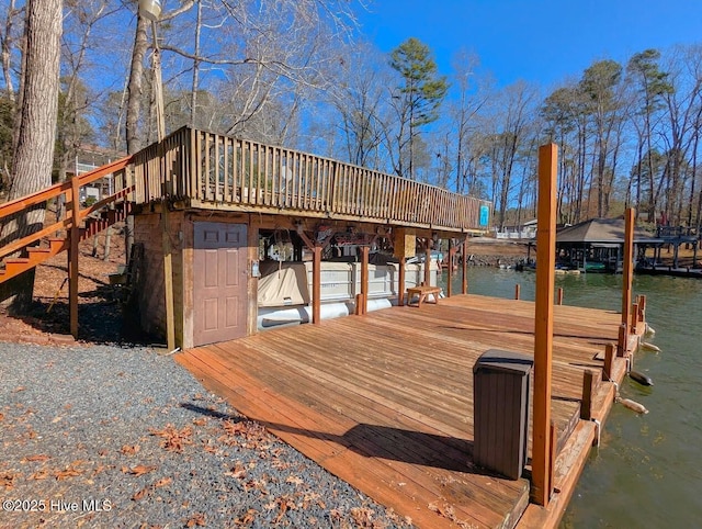 view of dock featuring stairway and a water view