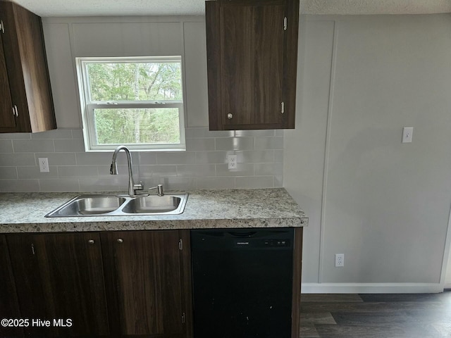 kitchen with dishwasher, dark brown cabinetry, light countertops, and a sink