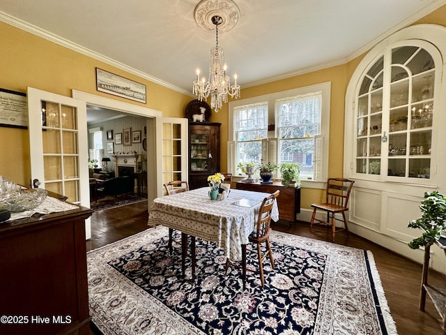 204 N Granville St, Edenton, NC 27932 - dining area featuring crown molding, dark wood-type flooring, and a chandelier