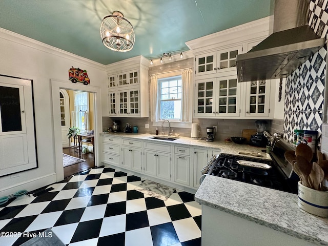 204 N Granville St, Edenton, NC 27932 - kitchen featuring tasteful backsplash, wall chimney range hood, gas range, tile patterned floors, and a sink