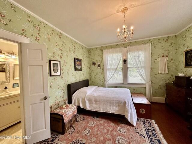 204 N Granville St, Edenton, NC 27932 - bedroom with wood finished floors, wallpapered walls, a sink, crown molding, and a chandelier