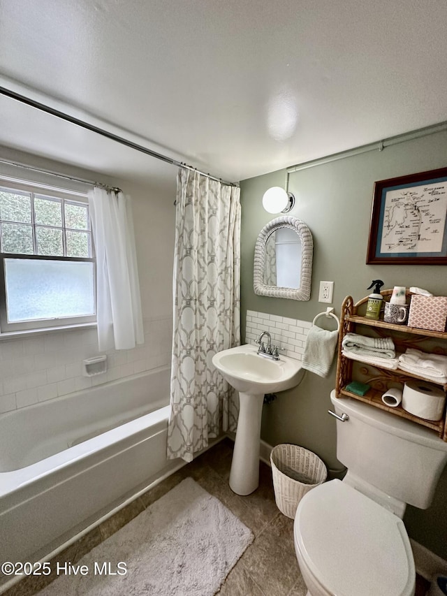 204 N Granville St, Edenton, NC 27932 - full bath with decorative backsplash, shower / bath combo with shower curtain, toilet, and tile patterned flooring