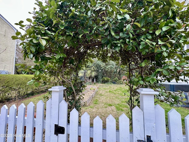 204 N Granville St, Edenton, NC 27932 - view of yard featuring a vegetable garden, cooling unit, and fence