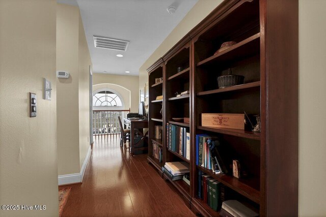 42 Harbour Village Ter, Hampstead, NC 28443 - corridor featuring visible vents, baseboards, and dark wood-style flooring