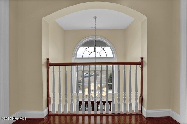 42 Harbour Village Ter, Hampstead, NC 28443 - room details with arched walkways, baseboards, and wood finished floors