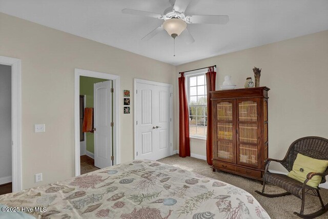 42 Harbour Village Ter, Hampstead, NC 28443 - bedroom featuring a closet, baseboards, carpet, and a ceiling fan