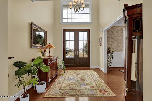 42 Harbour Village Ter, Hampstead, NC 28443 - foyer with a chandelier, french doors, baseboards, and wood finished floors