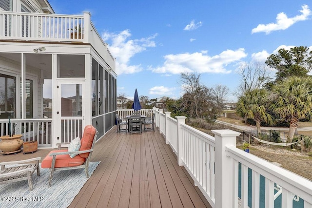42 Harbour Village Ter, Hampstead, NC 28443 - deck with outdoor dining space and a sunroom