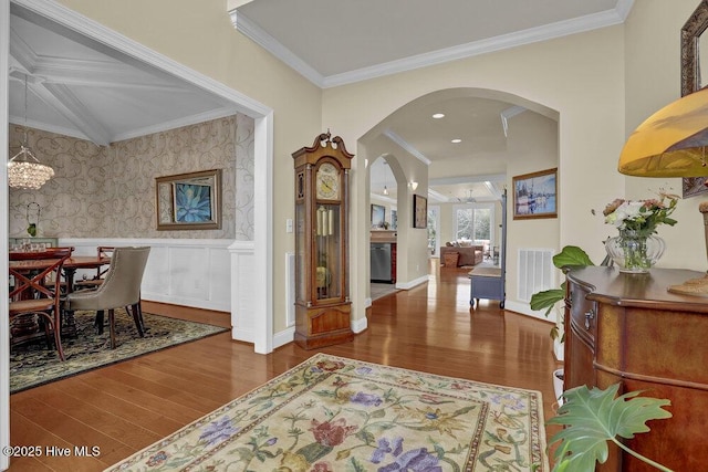 42 Harbour Village Ter, Hampstead, NC 28443 - interior space featuring wood finished floors, visible vents, arched walkways, ornamental molding, and a chandelier