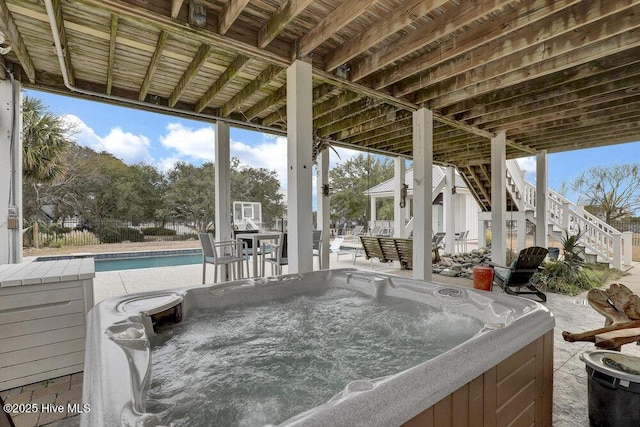 42 Harbour Village Ter, Hampstead, NC 28443 - view of patio with stairway, a fenced in pool, and a hot tub