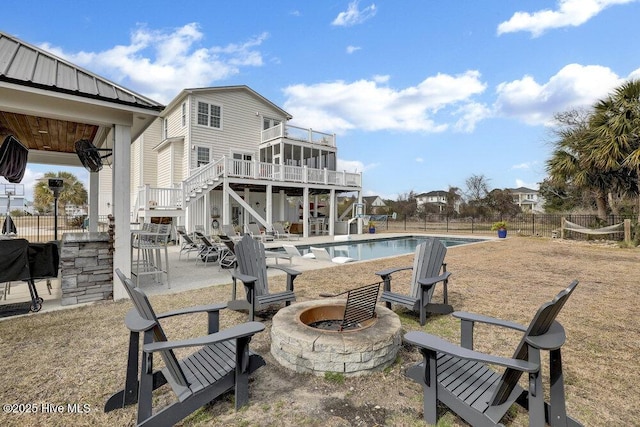 42 Harbour Village Ter, Hampstead, NC 28443 - view of pool featuring a patio, a fire pit, stairs, and fence