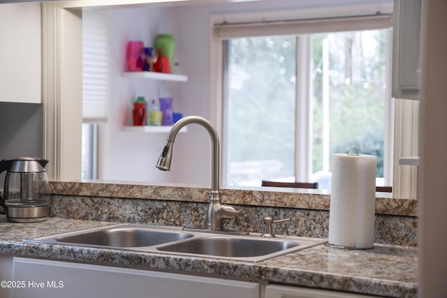 310 Wimbledon Ct, Wilmington, NC 28412 - kitchen view of a sink and white cabinets