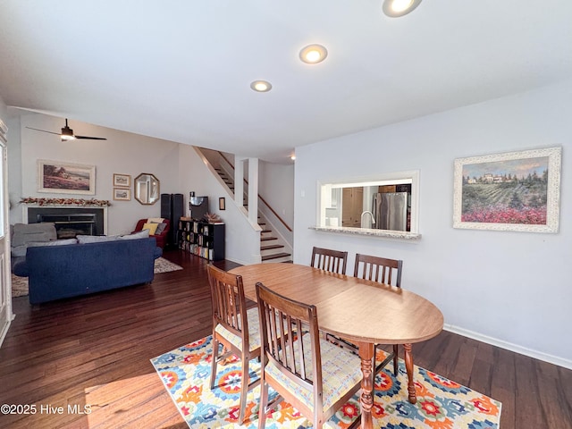 310 Wimbledon Ct, Wilmington, NC 28412 - dining room featuring stairway, ceiling fan, wood finished floors, recessed lighting, and a fireplace