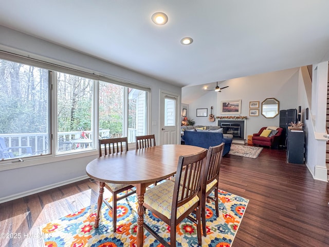 310 Wimbledon Ct, Wilmington, NC 28412 - dining room with dark wood finished floors, a glass covered fireplace, recessed lighting, a ceiling fan, and baseboards