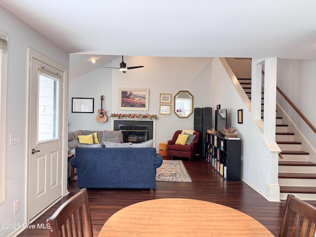 310 Wimbledon Ct, Wilmington, NC 28412 - living area featuring a ceiling fan, wood finished floors, stairway, a glass covered fireplace, and baseboards