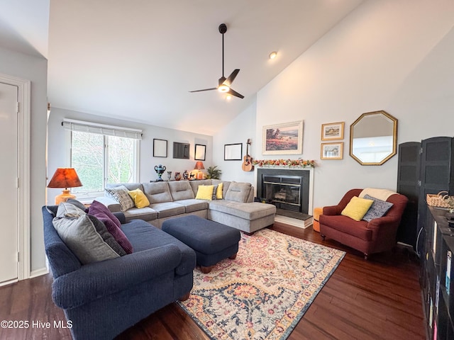 310 Wimbledon Ct, Wilmington, NC 28412 - living area with ceiling fan, a glass covered fireplace, dark wood-type flooring, and high vaulted ceiling