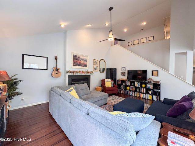 310 Wimbledon Ct, Wilmington, NC 28412 - living room with dark wood-type flooring, stairway, a fireplace, baseboards, and a ceiling fan