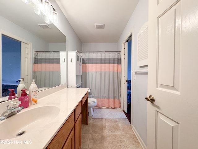 310 Wimbledon Ct, Wilmington, NC 28412 - bathroom featuring vanity, toilet, a shower with curtain, and tile patterned floors