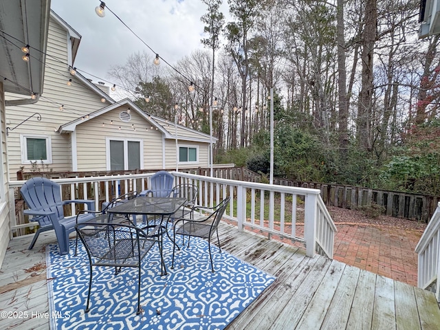 310 Wimbledon Ct, Wilmington, NC 28412 - wooden terrace with outdoor dining area