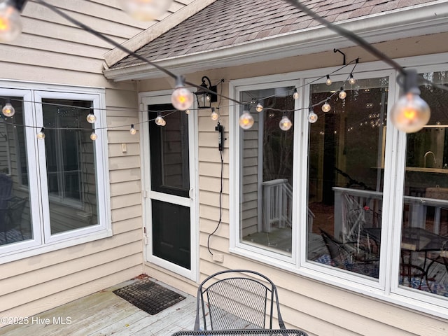 310 Wimbledon Ct, Wilmington, NC 28412 - view of exterior entry featuring roof with shingles