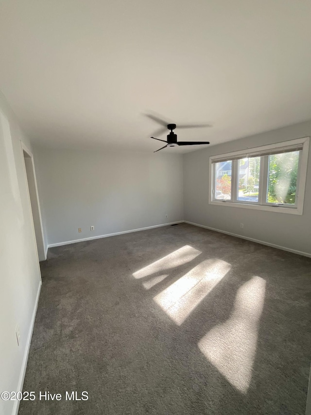 310 Wimbledon Ct, Wilmington, NC 28412 - spare room with dark colored carpet, baseboards, and ceiling fan