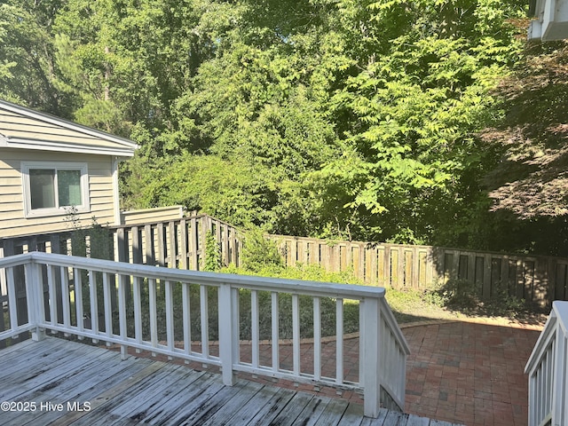 310 Wimbledon Ct, Wilmington, NC 28412 - wooden terrace featuring a fenced backyard and a wooded view
