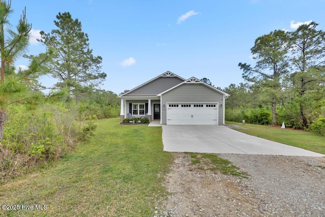 craftsman inspired home with an attached garage, driveway, and a front yard