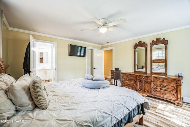 bedroom featuring light wood finished floors, ensuite bath, and ornamental molding