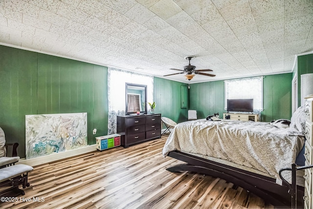 bedroom featuring ceiling fan and wood finished floors