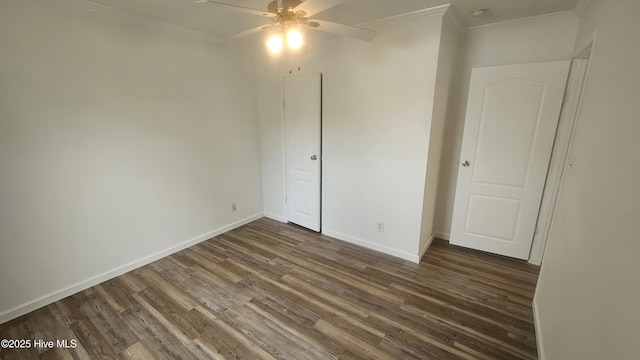 unfurnished bedroom with wood finished floors, a ceiling fan, baseboards, and ornamental molding