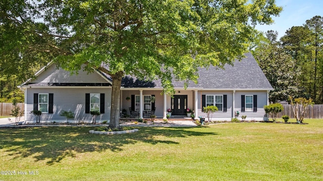 115 Marie Ct, Havelock, NC 28532 - view of front of house featuring a shingled roof, a front lawn, fence, and covered porch