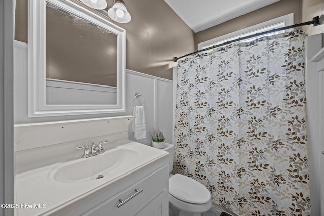 115 Marie Ct, Havelock, NC 28532 - bathroom with curtained shower, vanity, a wainscoted wall, and toilet