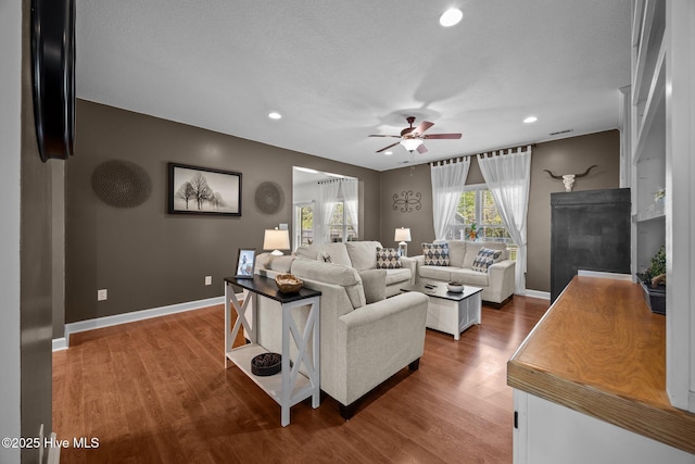 115 Marie Ct, Havelock, NC 28532 - living area featuring ceiling fan, recessed lighting, wood finished floors, and baseboards