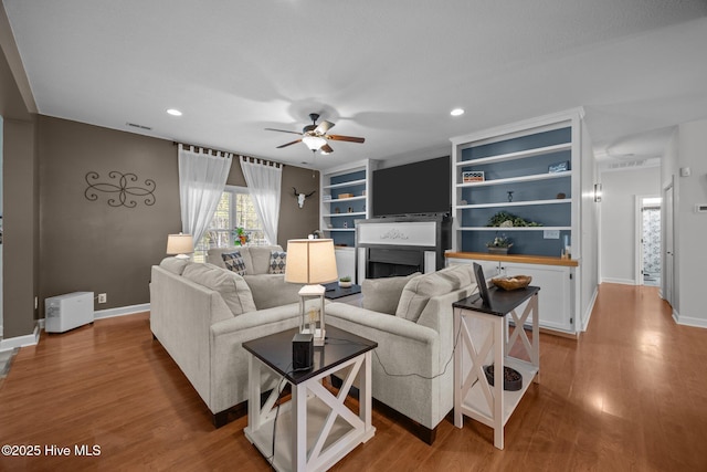 115 Marie Ct, Havelock, NC 28532 - living area featuring recessed lighting, a fireplace, baseboards, and a ceiling fan