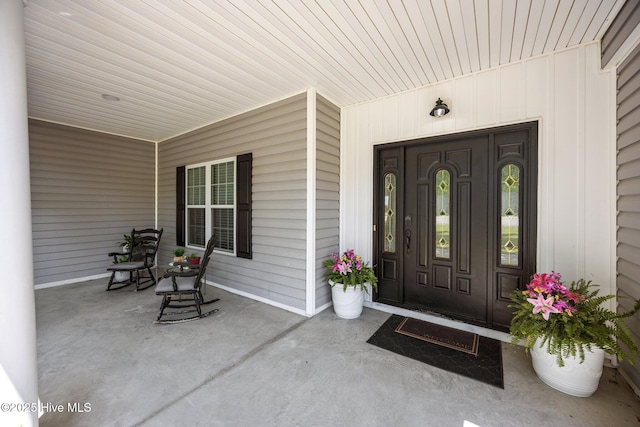 115 Marie Ct, Havelock, NC 28532 - view of exterior entry with a porch and board and batten siding