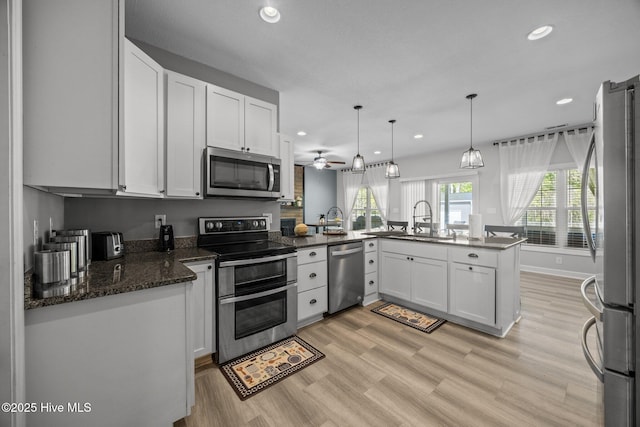 115 Marie Ct, Havelock, NC 28532 - kitchen with a sink, recessed lighting, appliances with stainless steel finishes, and a peninsula