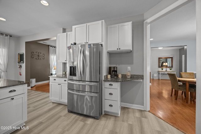 115 Marie Ct, Havelock, NC 28532 - kitchen featuring light wood-style flooring, recessed lighting, white cabinets, and stainless steel refrigerator with ice dispenser