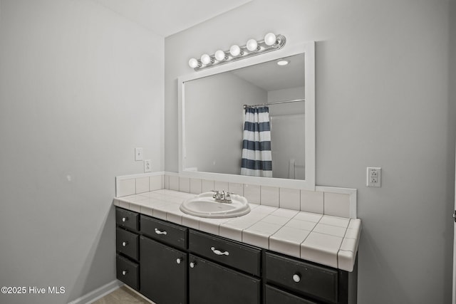 115 Marie Ct, Havelock, NC 28532 - bathroom featuring vanity, baseboards, and a shower with curtain
