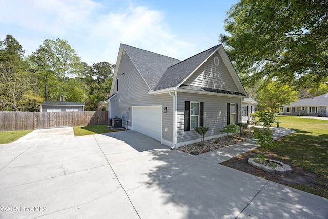 115 Marie Ct, Havelock, NC 28532 - view of home's exterior with a shingled roof, an attached garage, fence, central air condition unit, and driveway