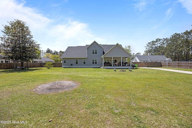 115 Marie Ct, Havelock, NC 28532 - rear view of property with a sunroom, a fenced backyard, and a lawn